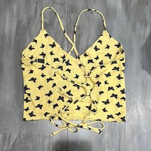 yellow and blue butterfly tank top with a lace up back